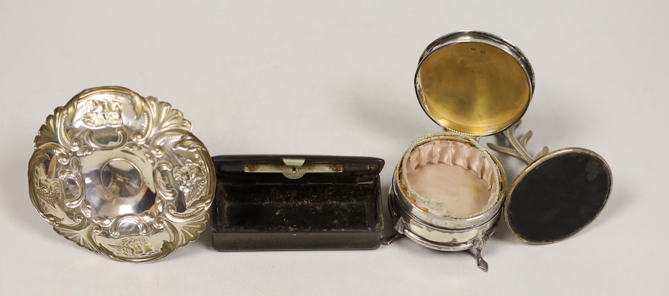 Two early 20th century silver ring stands, tallest 7cm, a small silver mounted trinket box and a 19th century inlaid wooden snuff box